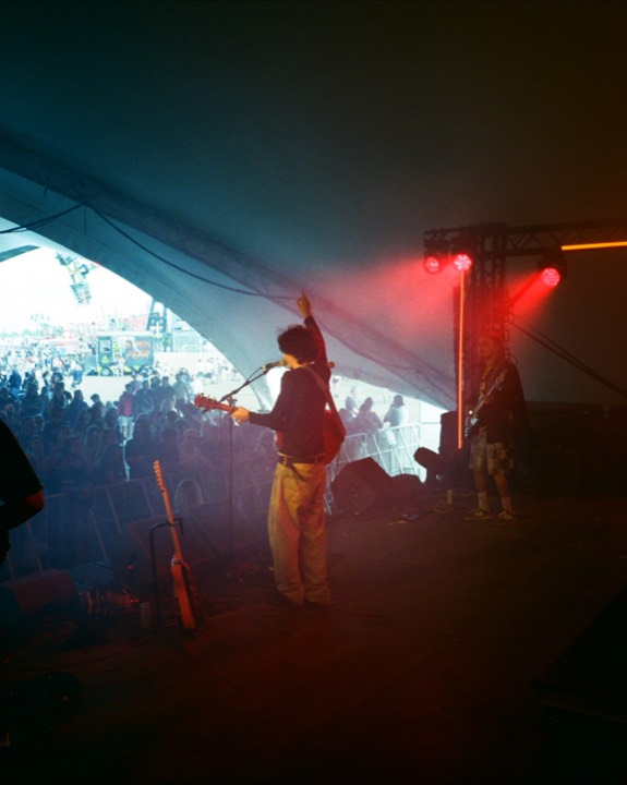 A singer under red and blue stage light